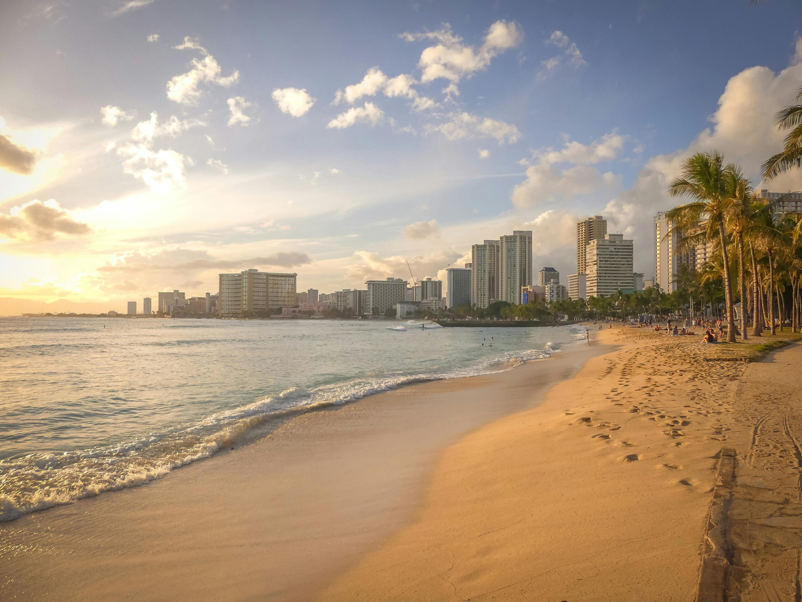 Image of beach with Honolulu in the background.